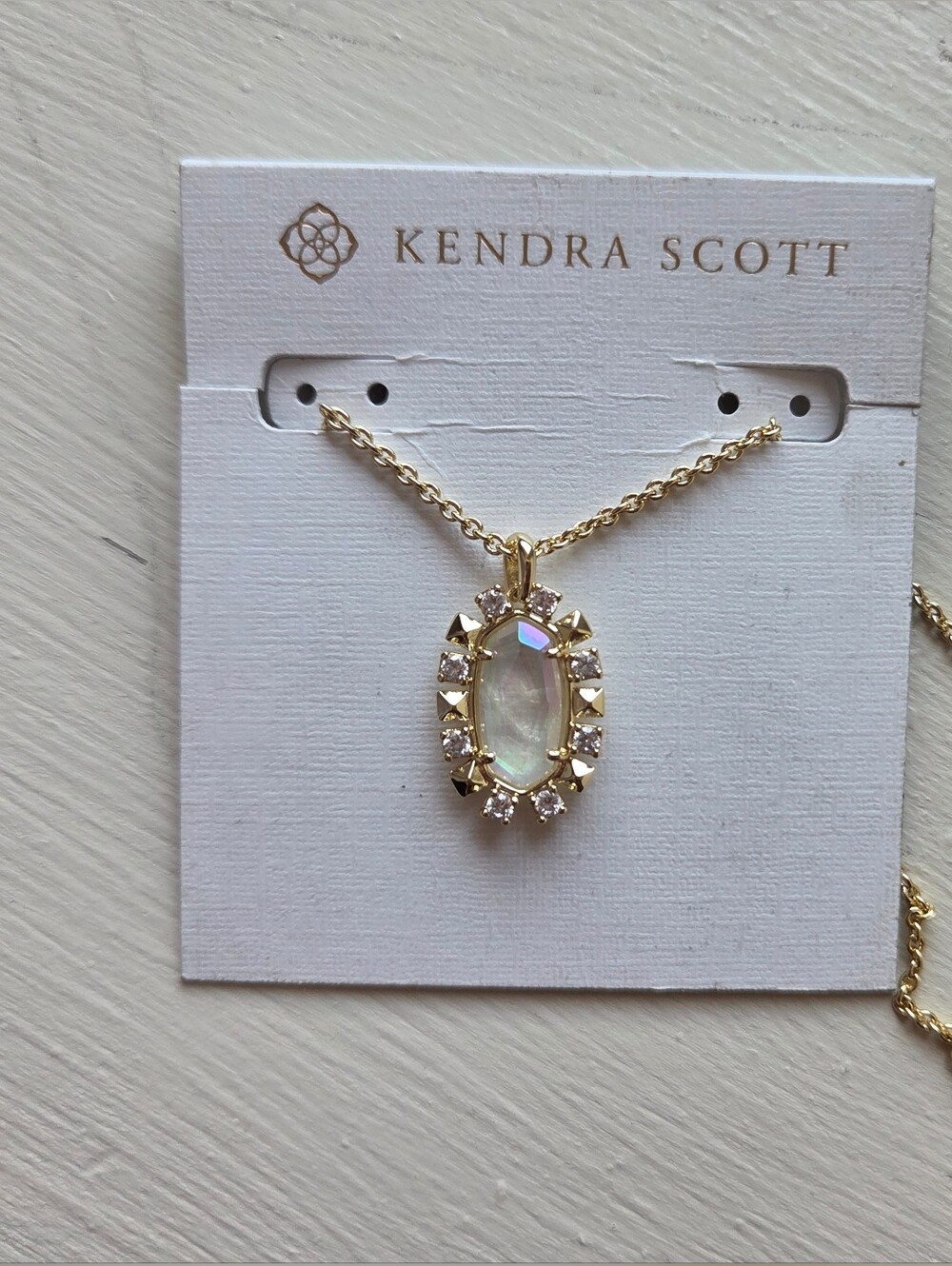 Kendra Scott Gold Necklace with Iridescent White Oval Pendant